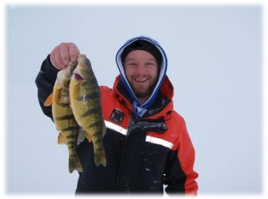 Izaak with a pair of twins caught on one of many cold blustery days in 2014.