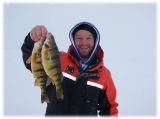 Izaak with a pair of twins caught on one of many cold blustery days in 2014.